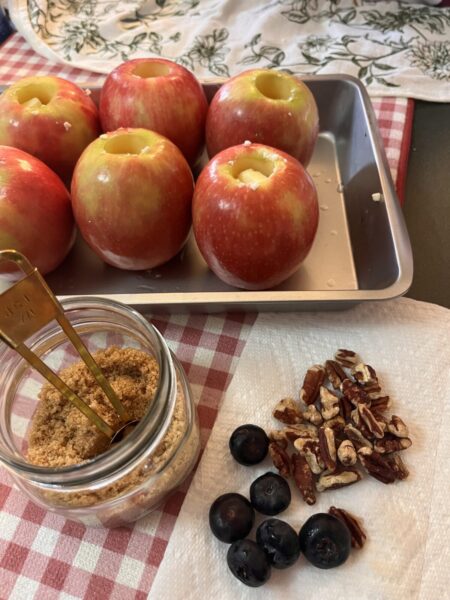 Apples, nuts, and berries wait to be assembled.